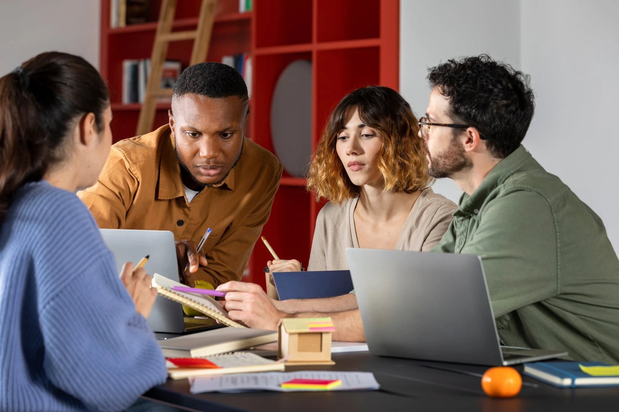 A team of educators working together around a table